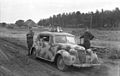 Wehrmacht soldiers with car and geese.